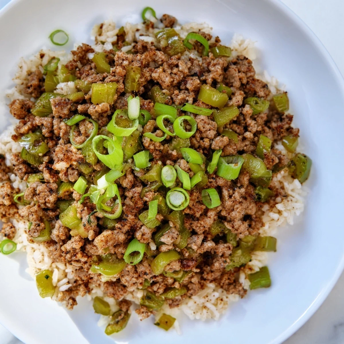 Delicious Cajun Dirty Rice, cooked until the rice is tender and the flavors meld together.