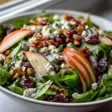 A refreshing Mixed Greens and Apple Bowl with crunchy walnuts and a tangy cider vinaigrette.