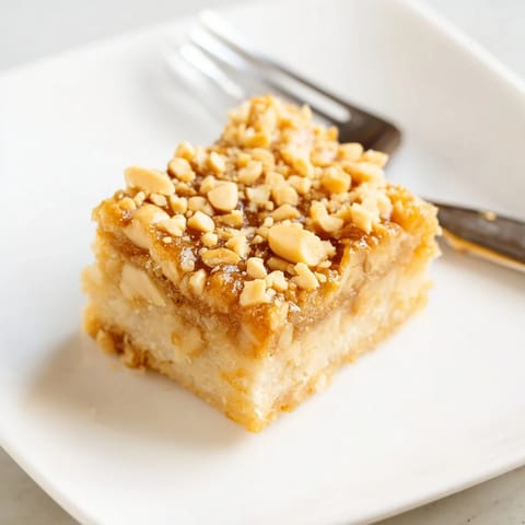 Golden-baked Peanut Butter Mochi Cake, with a soft, chewy texture perfect for dessert or a snack.